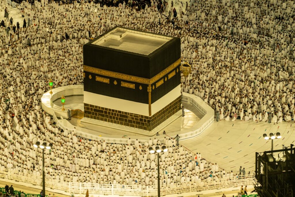 pexels-photo-12721555 Aerial view of the Kaaba in Mecca, Saudi Arabia, with thousands of pilgrims during Hajj season.