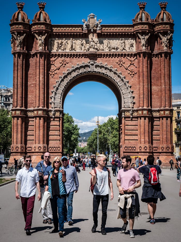 pexels-photo-2300595 People enjoying a sunny day at the iconic Arc de Triomf in Barcelona, a famous historical landmark.
